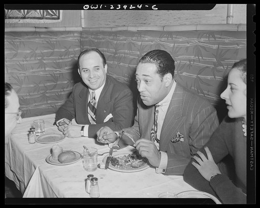 New York, New York. Duke Ellington having his dinner at the Hurricane with his wife, Bea Ellington, and a friend