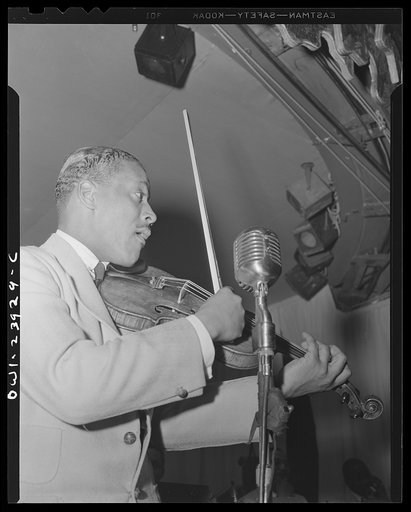 New York, New York. Ray Nance, trumpet player and violinist of Duke Ellington's orchestra, at the Hurricane Ballroom