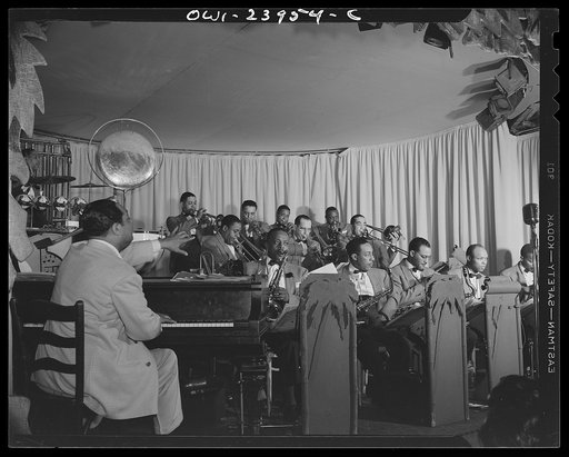 New York, New York. Duke Ellington directing his band from the piano