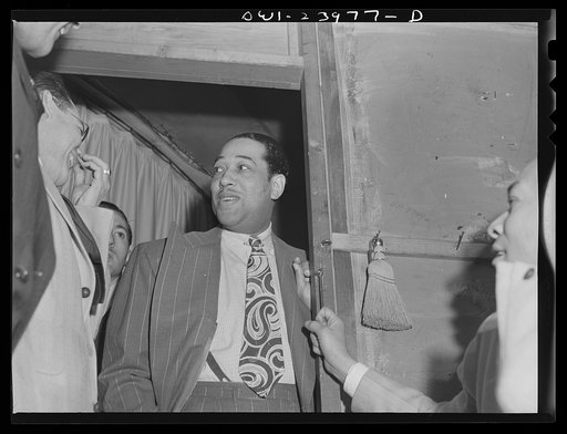 New York, New York. Duke Ellington chats with members of his orchestra