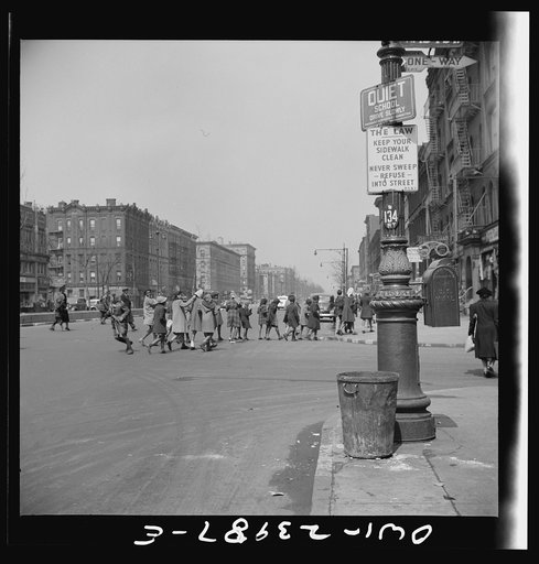 New York, New York. Many accidents are attributed to unpatrolled intersections in Harlem. Here school children are allowed to run across busy intersections unescorted