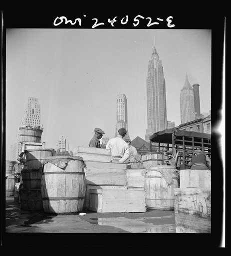 New York, New York. Fish caught off the New England coast is packed in these barrels and boxes and shipped to the retailers