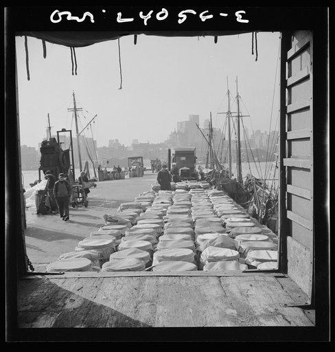 New York, New York. Barrels of fish on the docks at Fulton fish market ready to be shipped to retailers and wholesalers