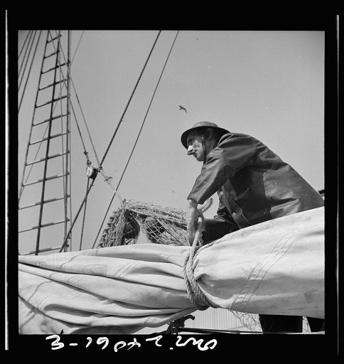 Untitled photo, possibly related to: New York, New York. A New England fisherman preparing his boat to leave the New York docks
