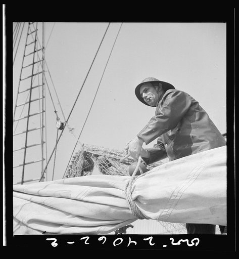 A New England fisherman preparing his boat to leave the New York docks