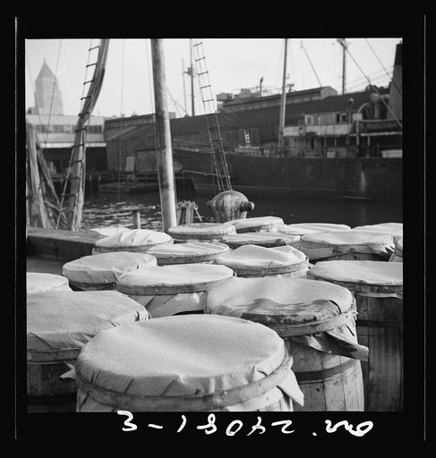 New York, New York. Barrels of fish on the docks at the Fulton fish market ready to be shipped to retailers