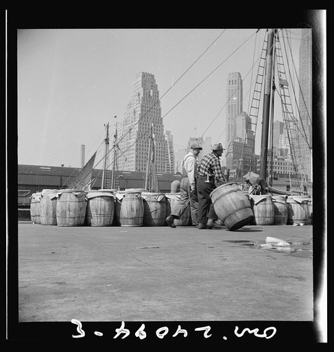 New York, New York. Barrels of fish on the docks at Fulton fish market ready to be shipped to retailers