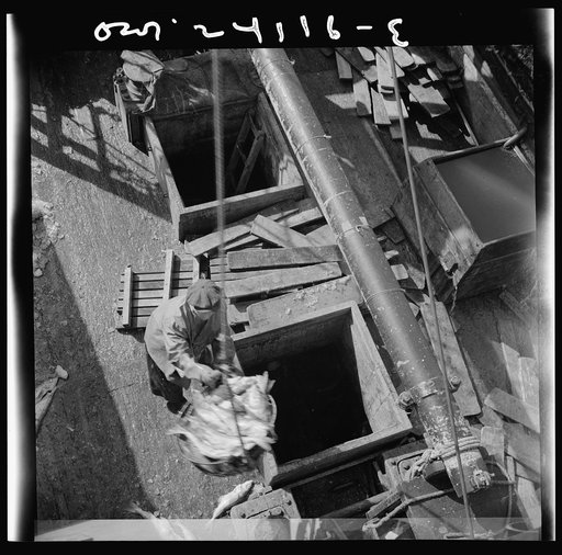 Untitled photo, possibly related to: New York, New York. Unloading fish from the hold of a New England fishing boat at the Fulton market