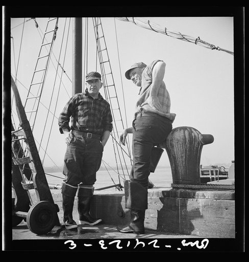 New York, New York. New England fishermen resting on the Fulton docks