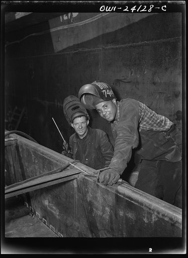 Baltimore, Maryland. Two rod welders helping to build the Liberty ship Frederick Douglass at the Bethlehem-Fairfield shipyards