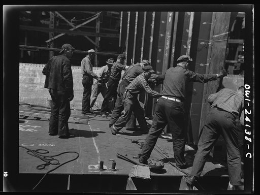 Building the SS Frederick Douglass. More than 6,000 Negro shipyard workers are employed at the Bethlehem-Fairfield shipyards, where the Liberty ship is being rushed to completion. The noted orator and abolitionist leader worked as a ship caulker in the vicinity of this yard before he escaped from sl