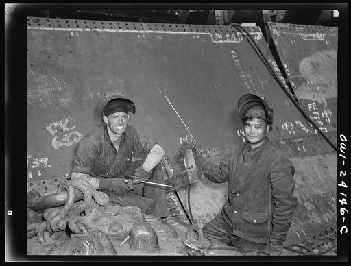 Untitled photo, possibly related to: Baltimore, Maryland. Electric welders at work on the Liberty ship Frederick Douglass at the Bethlehem-Fairfield shipyards
