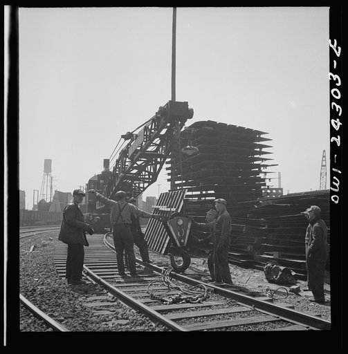 Bethlehem-Fairfield shipyards, Baltimore, Maryland. Steam crane operating in a stockyard