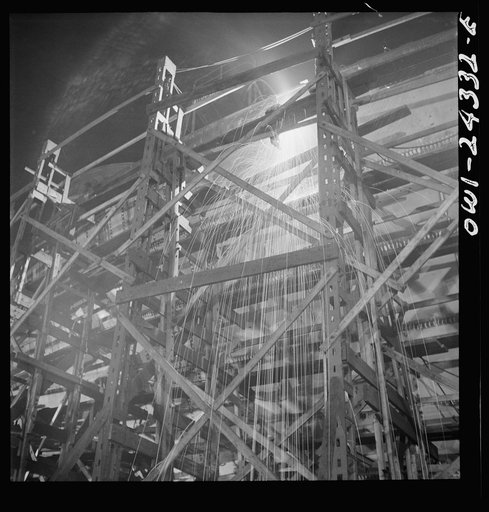 Bethlehem-Fairfield shipyards, Baltimore, Maryland. Welding on the shell of a ship