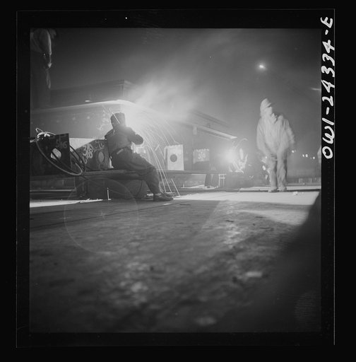 Untitled photo, possibly related to: Baltimore, Maryland. Third shift workers waiting on street corner to be picked up by shared cars around midnight