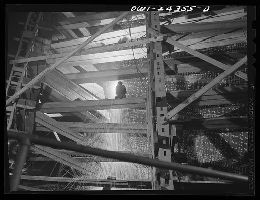 Bethlehem-Fairfield shipyards, Baltimore, Maryland. Welding on a shell at night