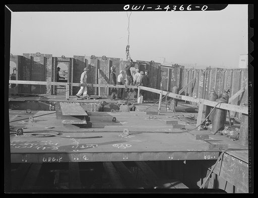 Bethlehem-Fairfield shipyards, Baltimore, Maryland. Erecting a deck house bulkhead