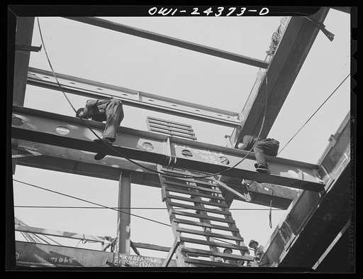 Bethlehem-Fairfield shipyards, Baltimore, Maryland. Working on the hatch, shifting beams
