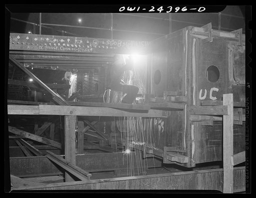 Bethlehem-Fairfield shipyards, Baltimore, Maryland. A welder working the sub-assembly of an after deck house