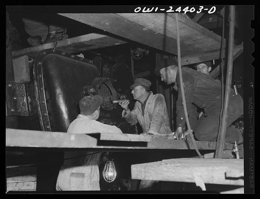 Bethlehem-Fairfield shipyards, Baltimore, Maryland. Inspecting a condenser