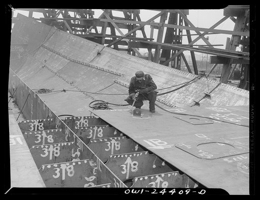 Bethlehem-Fairfield shipyards, Baltimore, Maryland. Burning off a lifting clip