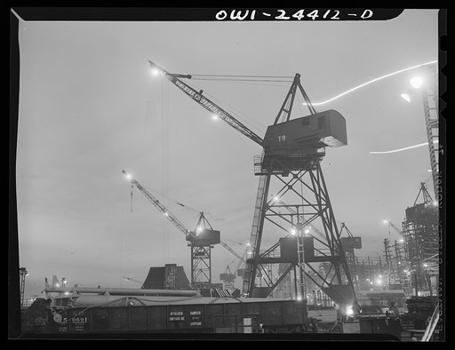 Bethlehem-Fairfield shipyards, Baltimore, Maryland. Cranes at night