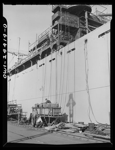 Bethlehem-Fairfield shipyards, Baltimore, Maryland. Welders attaching lines to the banks of a resistory or units