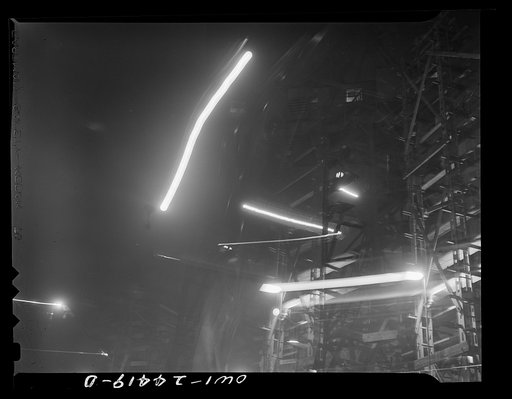 Untitled photo, possibly related to: Bethlehem-Fairfield shipyards, Baltimore, Maryland. The outline of the cranes in the sky at night