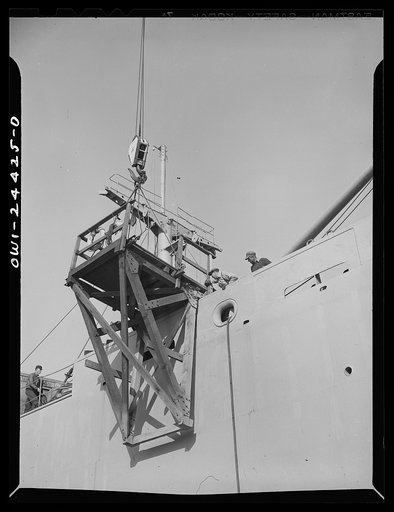 Bethlehem-Fairfield shipyards, Baltimore, Maryland. Placing a gangway on a ship