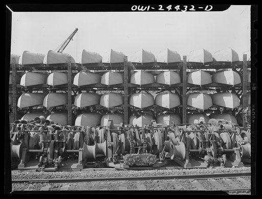 Bethlehem-Fairfield shipyards, Baltimore, Maryland. Anchor windlass and lifeboats in storage