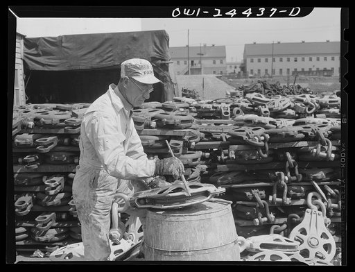 Bethlehem-Fairfield shipyards, Baltimore, Maryland. Painting a sheave