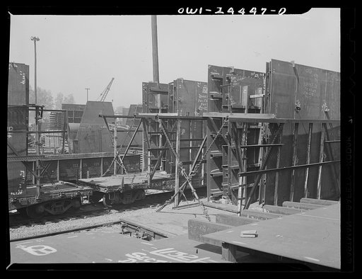 Bethlehem-Fairfield shipyards, Baltimore, Maryland. Unloading assembled deck sections in a stockyard