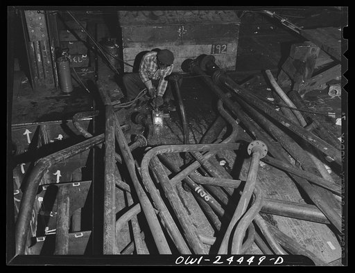 Bethlehem-Fairfield shipyards, Baltimore, Maryland. A burner at work in the engine room