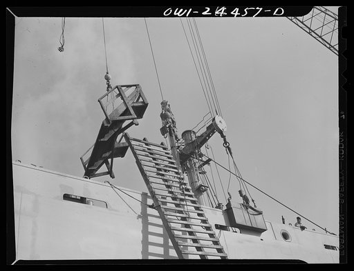 Bethlehem-Fairfield shipyards, Baltimore, Maryland. Removing a ladder and platform from a ship