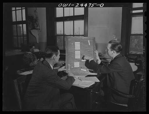 Bethlehem-Fairfield shipyards, Baltimore, Maryland. Discussing ships on the ways and at the piers