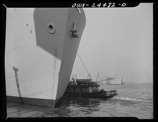 Bethlehem-Fairfield shipyards, Baltimore, Maryland. Tugs shifting Liberty ships
