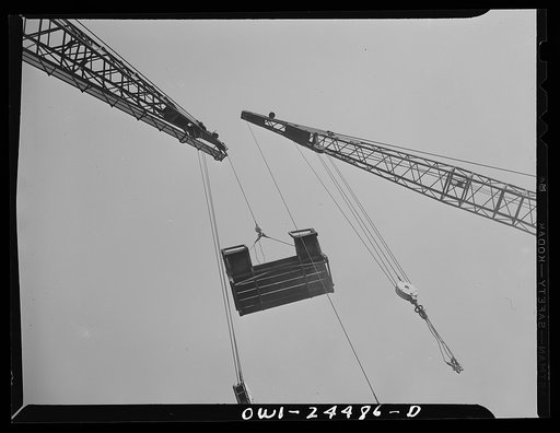 Bethlehem-Fairfield shipyards, Baltimore, Maryland. Lifting a launching platform