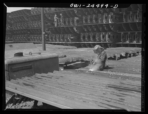 Bethlehem-Fairfield shipyards, Baltimore, Maryland. Welding brackets on shell frames