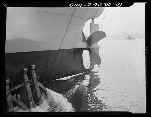 Bethlehem-Fairfield shipyards, Baltimore, Maryland. A ship, showing the after poppet of the cradle, just hitting the water as she is launched