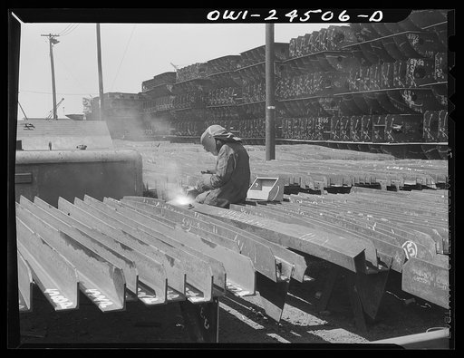 Bethlehem-Fairfield shipyards, Baltimore, Maryland. Welding brackets to a shell frame