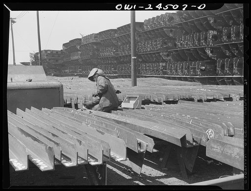 Untitled photo, possibly related to: Bethlehem-Fairfield shipyards, Baltimore, Maryland. Welding brackets to a shell frame