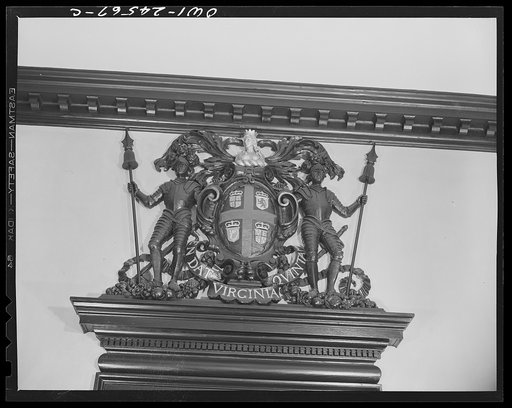 Williamsburg, Virginia. The capitol of the Virginia colony during the eighteenth century was reconstructed and restored to its original state by John D. Rockefeller, Jr. during the 1930s. Coat of arms of the Virginia colony above the door in the General Courtroom of the capitol