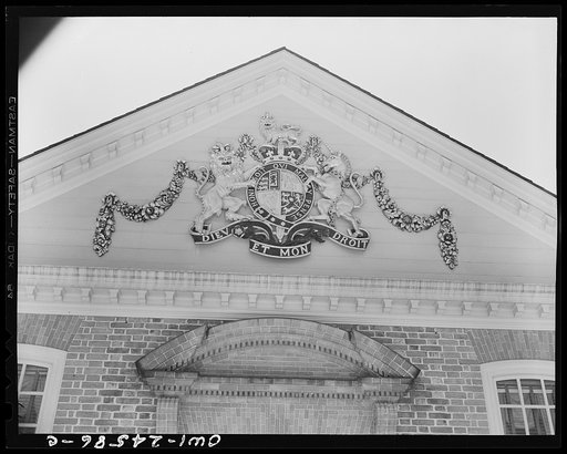 Williamsburg, Virginia. The capitol of the Virginia colony during the eighteenth century which was reconstructed and restored to its original state by John D. Rockefeller, Jr. during the 1930s. Coat of arms of Charles I of England, in whose reign the palace was completed, above the ballroom wing
