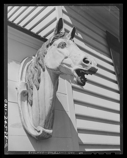 Williamsburg, Virginia. The capitol of the Virginia colony during the eighteenth century which was reconstructed and restored to its original state by John D. Rockefeller, Jr. during the 1930s. Horse decoration in front of the blacksmith shop