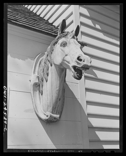 Untitled photo, possibly related to: Williamsburg, Virginia. The capitol of the Virginia colony during the eighteenth century which was reconstructed and restored to its original state by John D. Rockefeller, Jr. during the 1930s. Horse decoration in front of the blacksmith shop