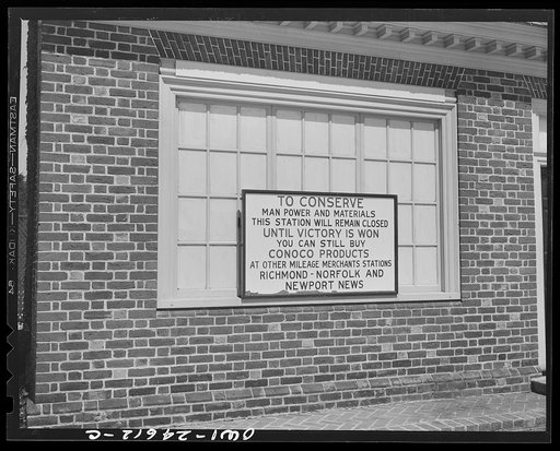 Untitled photo, possibly related to: Williamsburg, Virginia. The capitol of the Virginia colony during the eighteenth century which was reconstructed and restored to its original state by John D. Rockefeller, Jr. during the 1930s. Sign on a gasoline station