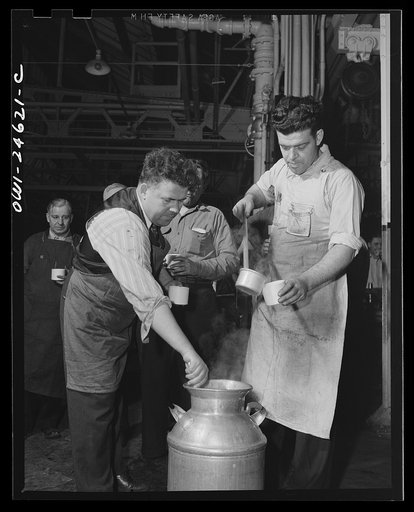 Lunch hour for the workmen in a big Midwest plant where old tires are transformed