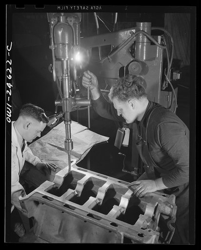 Scene in a shop where high school boys help the workers after school hours to relieve the manpower shortage