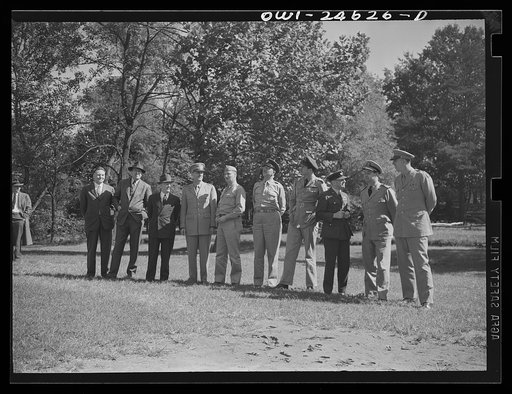 Untitled photo, possibly related to: Montgomery Blair High school Victory Corps. Gold braid and official titles decorated the training field at Montgomery Blair High School in Silver Spring, Maryland, when Army, Navy, and civilian officers reviewed the Victory Corps maneuvers. Left to right: Merwin 