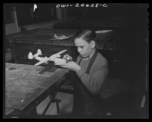 Untitled photo, possibly related to: Montgomery Blair High School, Silver Spring, Maryland. Making model planes according to Navy specifications to be used in the training of military and civilian personnel